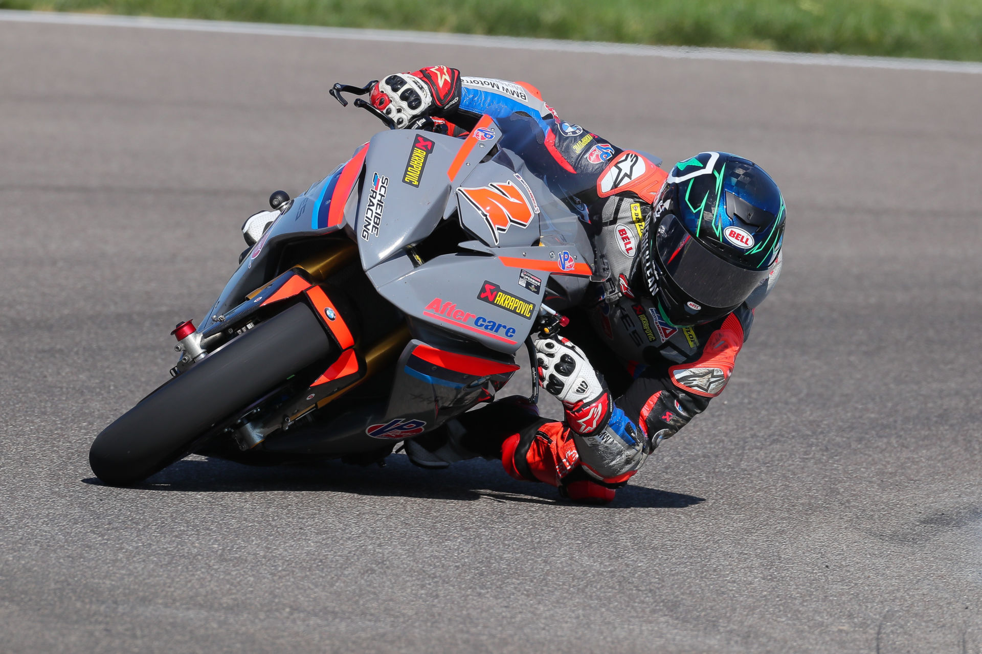 Josh Herrin (2) leaned over on his Scheibe Racing BMW S1000RR MotoAmerica Superbike at Indianapolis Motor Speedway. Photo by Brian J. Nelson.