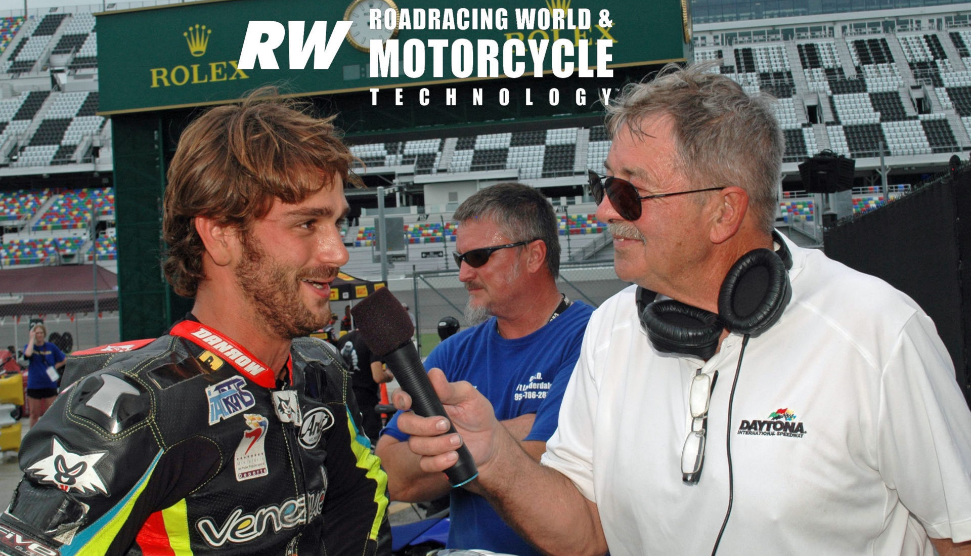 Daytona International Speedway public address announcer and former racer Richard Chambers (right) interviewing former Latin America Superbike Champion and current Sporting Director for the Italtrans Racing Moto2 World Championship team Robertino Pietri (left) at Daytona International Speedway in 2016. Photo by David Swarts.