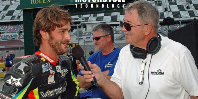 Daytona International Speedway public address announcer and former racer Richard Chambers (right) interviewing former Latin America Superbike Champion and current Sporting Director for the Italtrans Racing Moto2 World Championship team Robertino Pietri (left) at Daytona International Speedway in 2016. Photo by David Swarts.