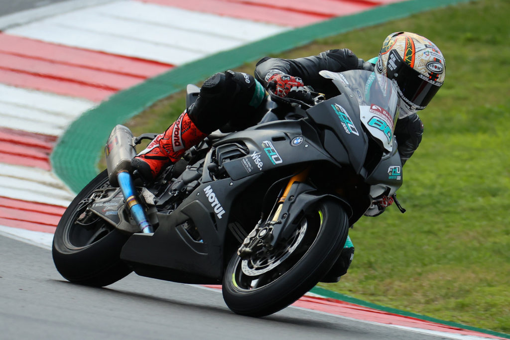 Peter Hickman (60) at speed in the wet on his FHO Racing BMW S1000RR Superbike at Algarve International Circuit, in Portugal. Photo courtesy FHO Racing BMW.