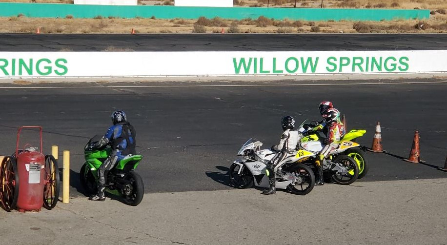 Tony Serra (left), age 81, prepares to go out on track at Willow Springs with a trio of younger riders (right). Photo courtesy WERA.