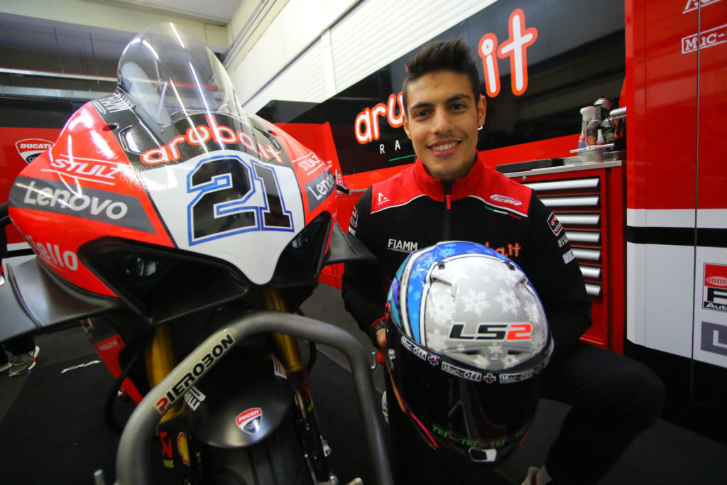 Michael Ruben Rinaldi shows off his new helmet and new Aruba.it Racing Ducati. Photo courtesy Dorna WorldSBK Press Office.