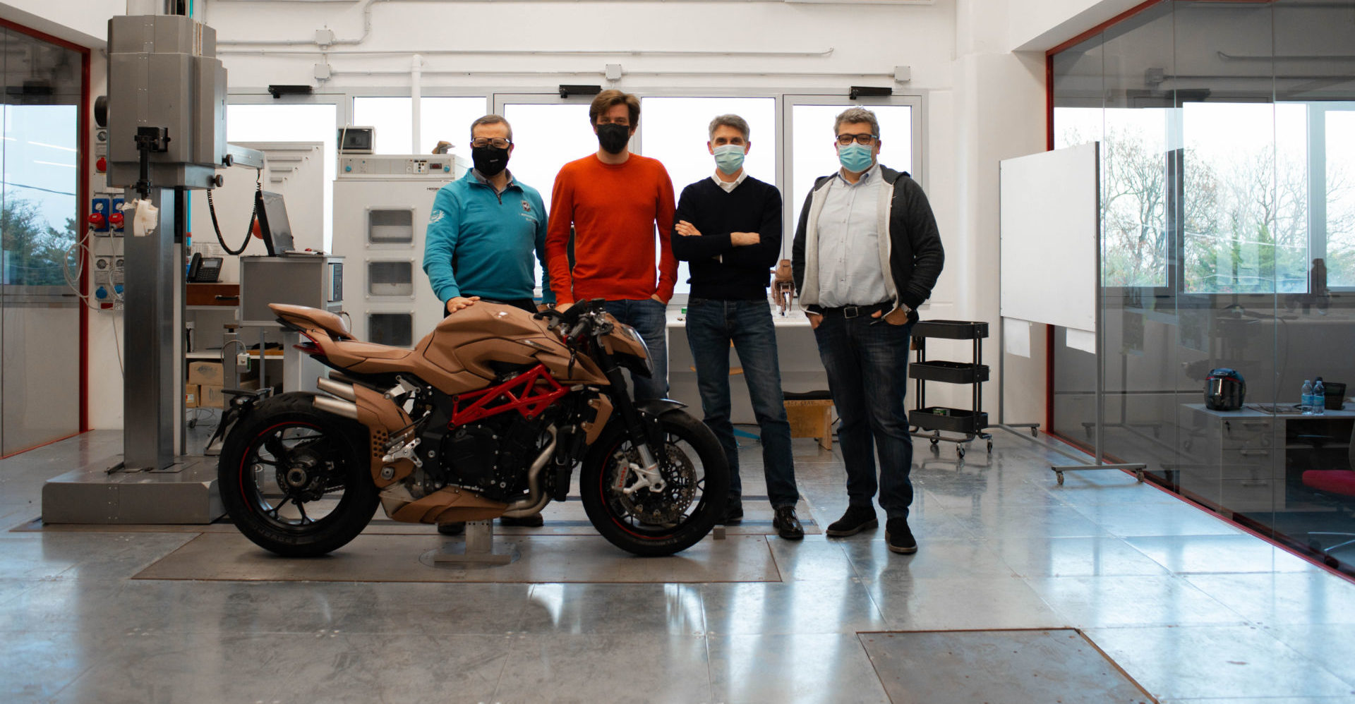 (From left) Alessandro Volpini, Timur Sardarov, Brian Gillen and Giorgio Mazzotti at MV Agusta’s new design center in San Marino. Photo courtesy MV Agusta.