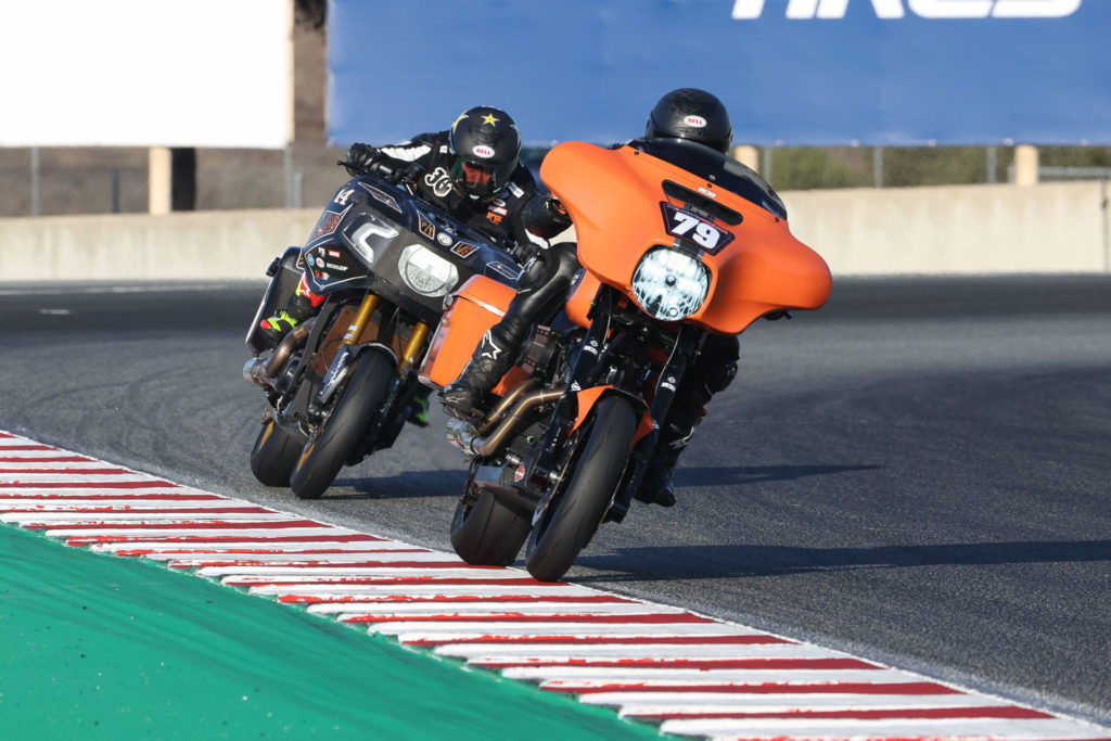 Hayden Gillim (79), riding a Vance & Hines Harley-Davidson Electra Glide Standard, and Frankie Garcia (14), riding a RSD Indian Challenger, battle for second place in the MotoAmerica King of the Baggers race at Laguna Seca. Photo by Brian J. Nelson.