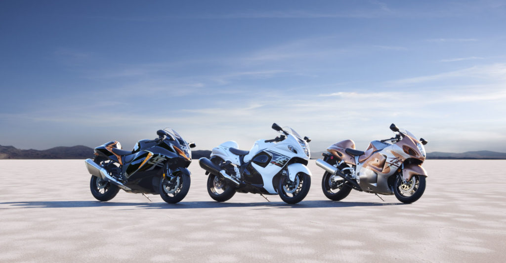 The 2022 Suzuki Hayabusa comes in three color schemes: Glass Sparkle Black & Candy Burnt Gold (left), Pearl Brilliant White & Metallic Matte Stellar Blue (center) and Metallic Matte Sword Silver & Candy Daring Red (right). Photo courtesy Suzuki Motor of America, Inc.