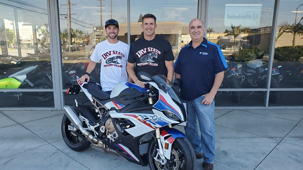 (From left) Travis Wyman Racing team owner Travis Wyman, BMW HP Race Engineer Steve Weir, and Irv Seaver BMW General Manager David Diaz. Photo courtesy Travis Wyman Racing.