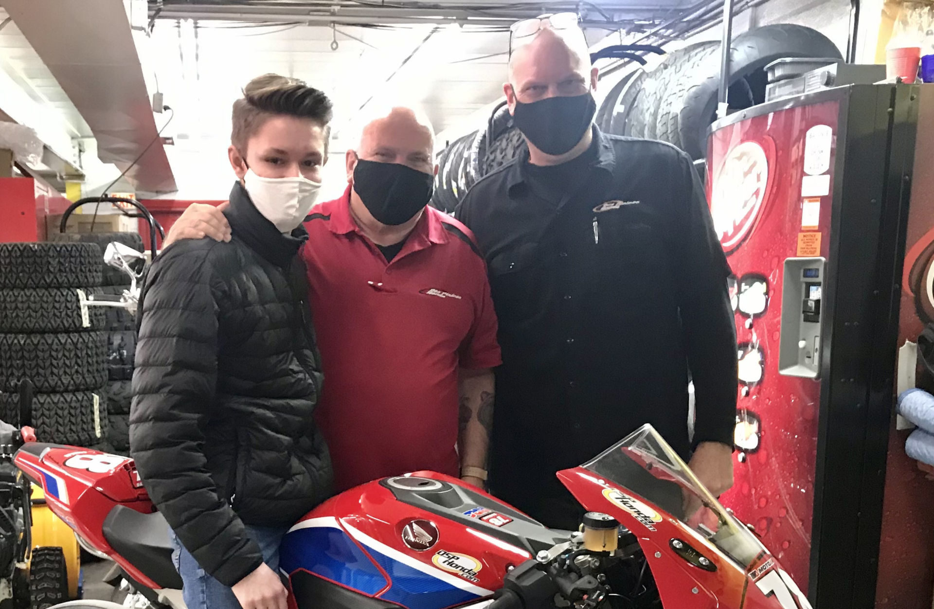 DSP Honda General Manager John Lawson (right) and Parts Associate Gary Landow (center) with racer Damian Jigalov (left). Photo by Adrian Jigalov.