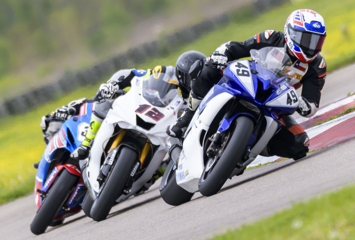 Kyle Coles (49) leads Joe Feco (12) and another rider during a CMRA sprint race at NOLA Motorsports Park. Photo by dgillenphoto.com, courtesy CMRA.