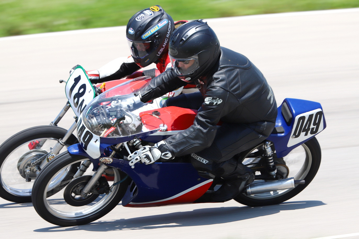 AHRMA racers Danny Habermel (049) and Louis LeBlanc (18N) in action. Photo by etechphoto.com, courtesy AHRMA.