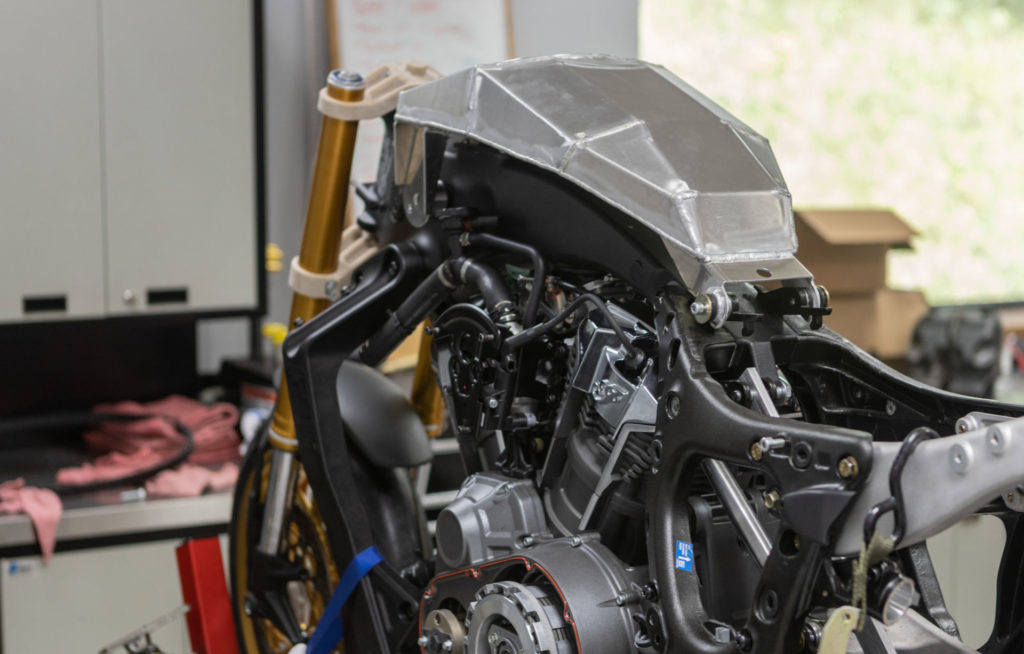 A small, custom, aluminum fuel cell is hidden under a carbon fiber cover that mimics the stock fuel tank. Photo courtesy S&S Cycle and MotoAmerica.