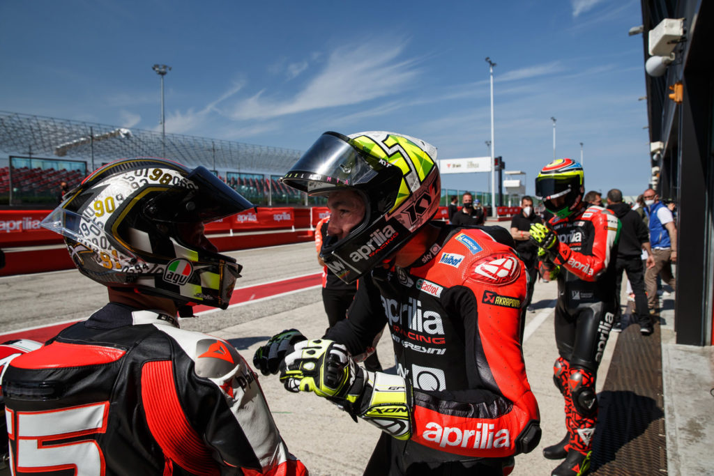 Loris Capirossi (left) and Aleix Espargaro (right) speak on pit lane at Misano. Photo courtesy Aprilia.