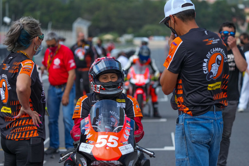 Mikey Lou Sanchez on the grid at Estoril with father Michael Sanchez (right) and mother Trinity Richardson (left). Photo courtesy Sanchez Racing.