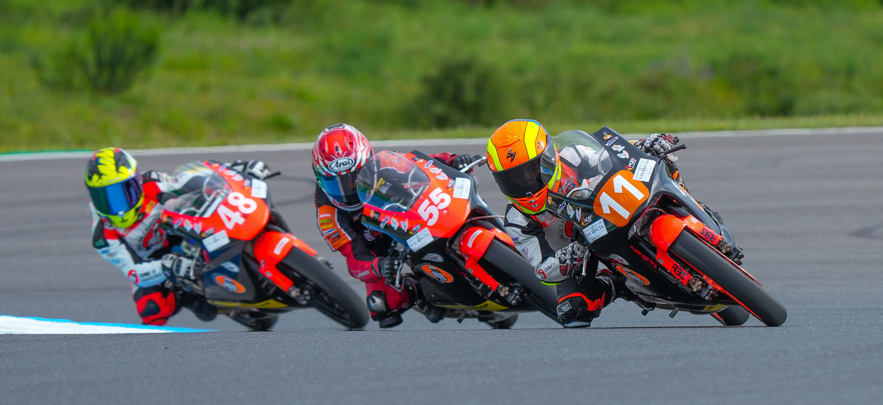 American Mikey Lou Sanchez (55) sandwiched in between Oliver Cantos Llorca (11) and Vasco Cesar Fonseca (48) during Cuna de Campeones Moto 5 Race Two at Portugal. Llorca won the race, and Sanchez crashed out while battling for the lead. Photo courtesy Sanchez Racing.