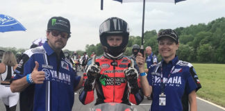 Karen Deutschlander (right) on the grid with son Dylan Deutschlander (center) at a MotoAmerica race. Photo by Brian J. Nelson.