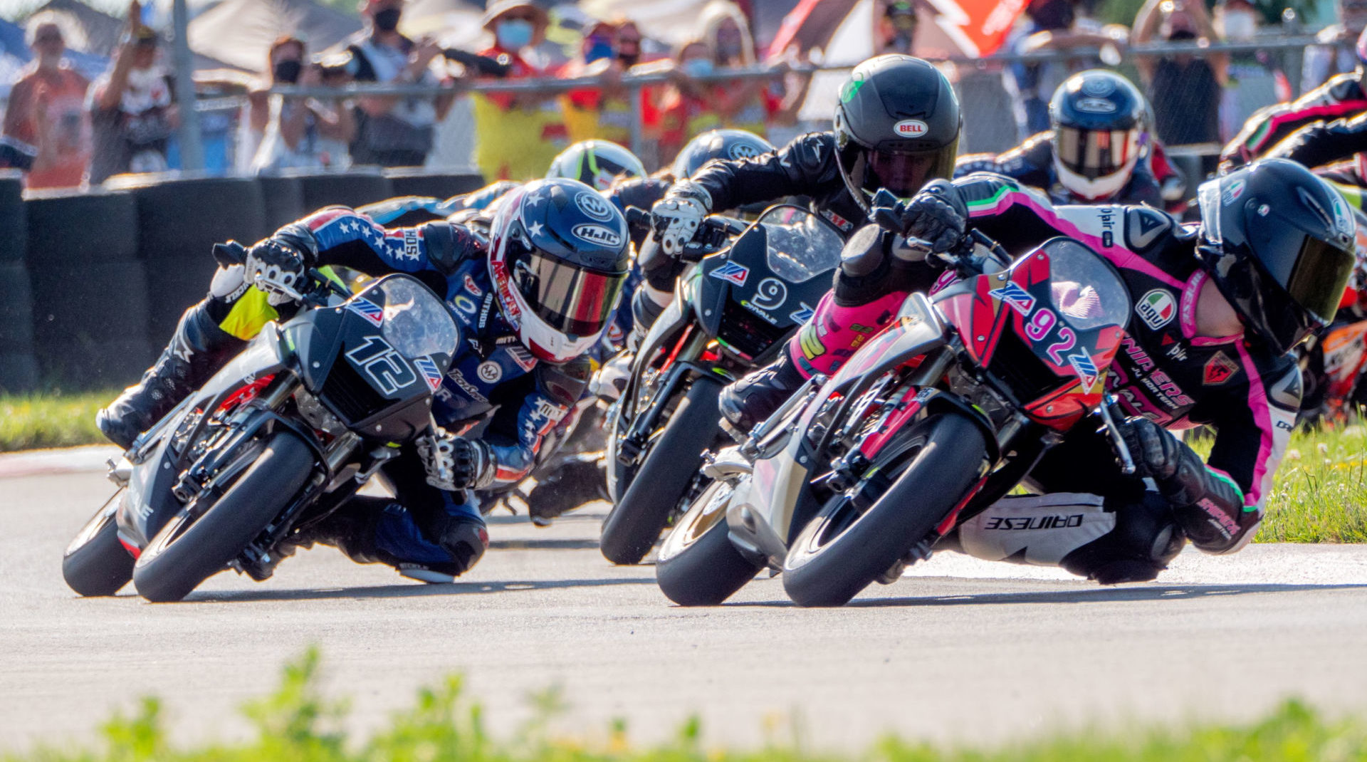 Rossi Moor (92) leads Travis Horn (12) and Jesse James Shedden (9) during a MotoAmerica Mini Cup by Motul race in 2020. Photo courtesy Dorna.