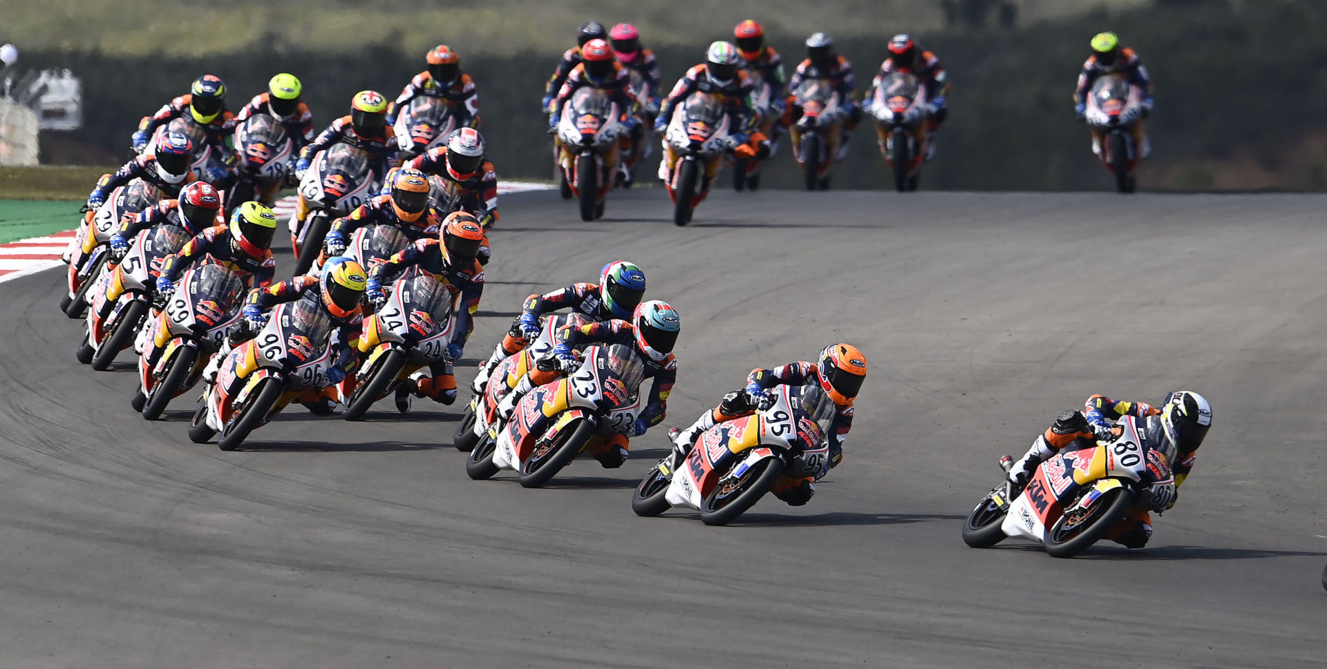 David Alonso (80) leads the start of Red Bull MotoGP Rookies Cup Race 2 in Portugal. Photo courtesy Red Bull.