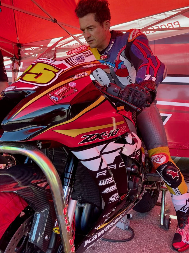 Actor Orlando Bloom prepares to go out on track on a FLY Racing/ADR Motorsports Kawasaki ZX-10RR Superbike. Photo courtesy Alpinestars.