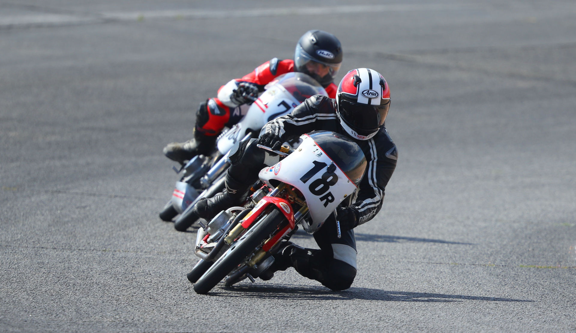 Gabriel Droetti (18R) leading another AHRMA rider during a 200GP race at Willow Springs International Raceway. Photo by etechphoto.com, courtesy AHRMA.