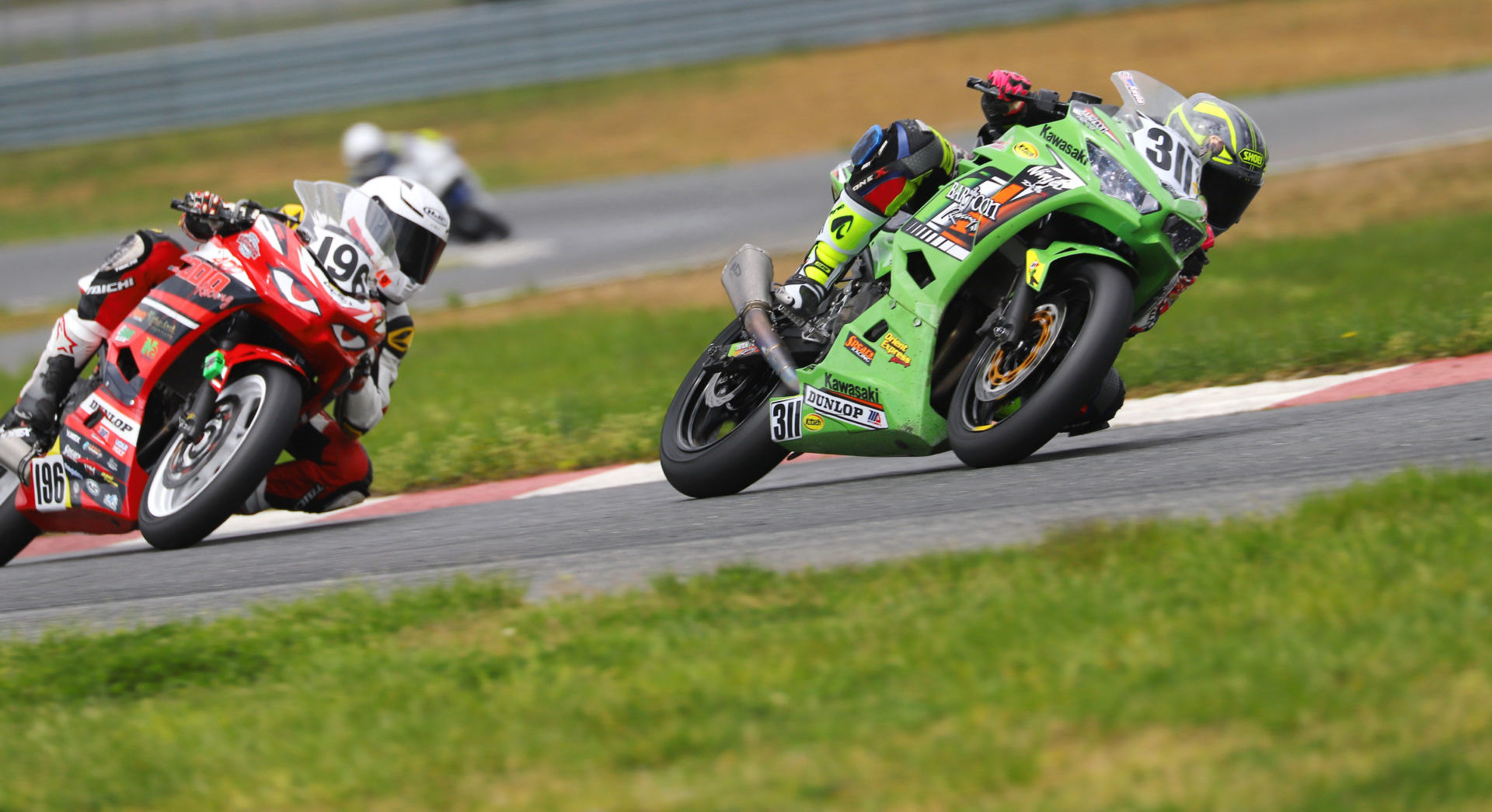 Kayla Yaakov (311) leads Gus Rodio (196) during the ASRA Moto3 National at New Jersey Motorsports Park. Photo by etechphoto.com, courtesy ASRA.