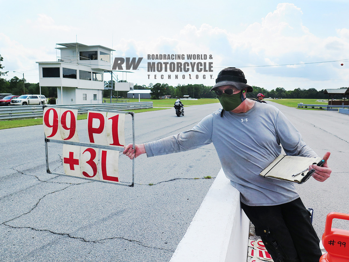 Masked Up: Tim Gooding deploys the pit-board update for Jake Lewis at Roebling Road. Photo by AOD.