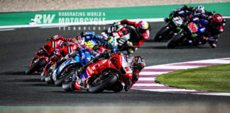Second-quickest qualifier Johann Zarco (5) chases pole-sitter Jorge Martin (already out of the frame) and leads Alex Rins (42), Francesco Bagnaia, Jack Miller, Joan Mir (36) Aleix Espargaró (41), Fabio Quartararo (20), and Maverick Viñales (12) early in the Moto-GP race during Qatar weekend #2. Photo by DPPI Media.