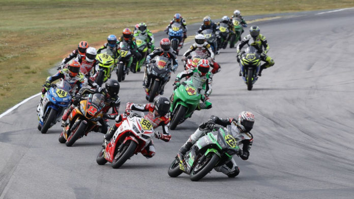Ben Gloddy (72) leads Max Toth (58), Jack Roach (12), Max Vanderbrouck (48), Cody Wyman (34), and the rest of the SportbikeTrackGear.com Junior Cup field early in Race One at VIR. Photo by Brian J. Nelson, courtesy MotoAmerica.