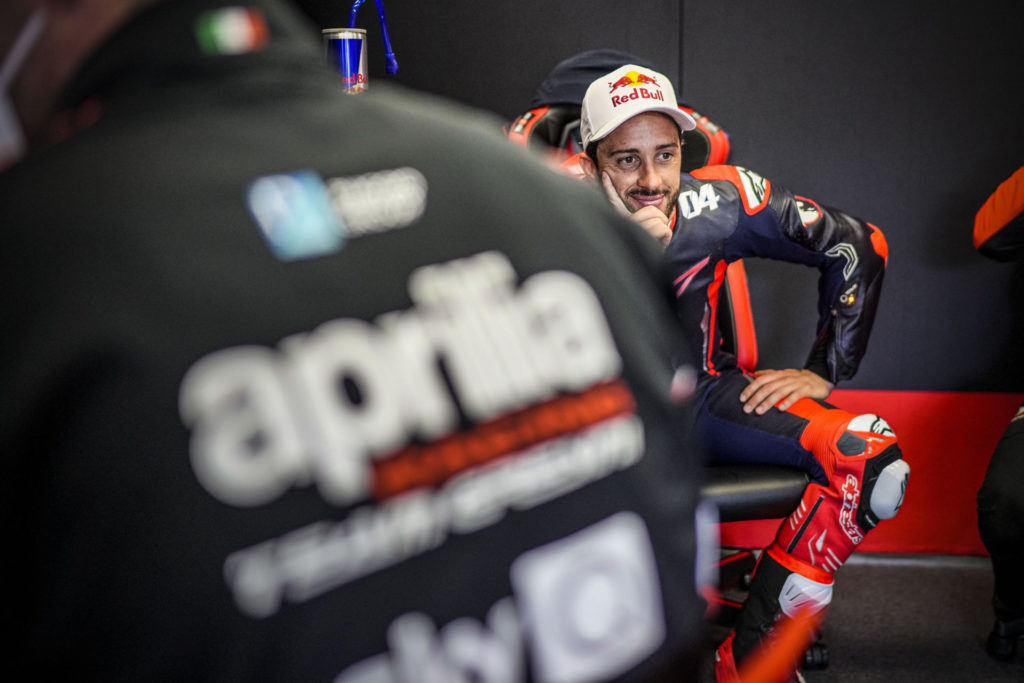 Andrea Dovizioso smiling in the garage at Mugello. Photo courtesy Aprilia.