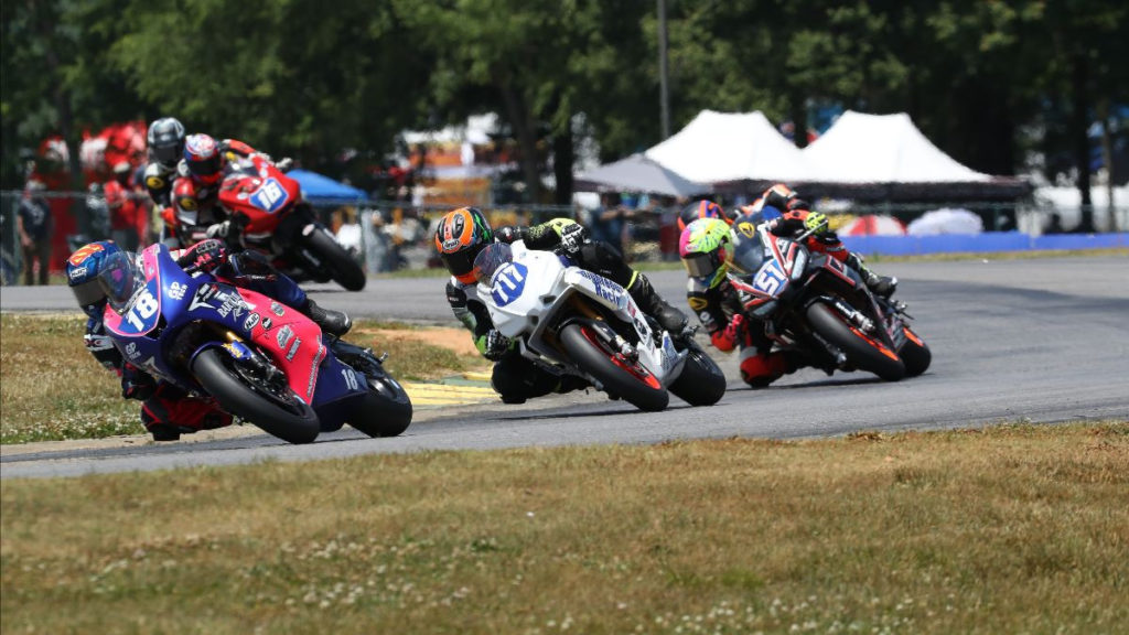 Jackson Blackmon (18), Jody Barry (717), Kaleb De Keyrel (51), and Trevor Standish (16) battle at the front during Twins Cup Race Two. Photo by Brian J. Nelson, courtesy MotoAmerica.