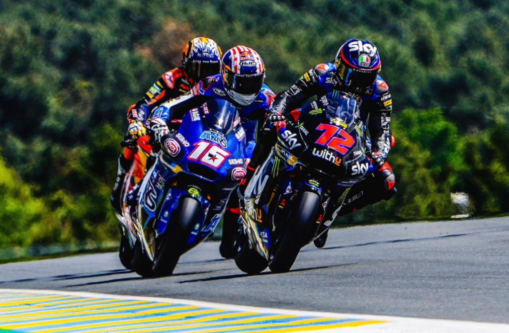 Joe Roberts (16) battling Marco Bezzecchi (72) and Raul Fernandez for the lead in the Moto2 race at Le Mans. Photo courtesy Italtrans Racing.