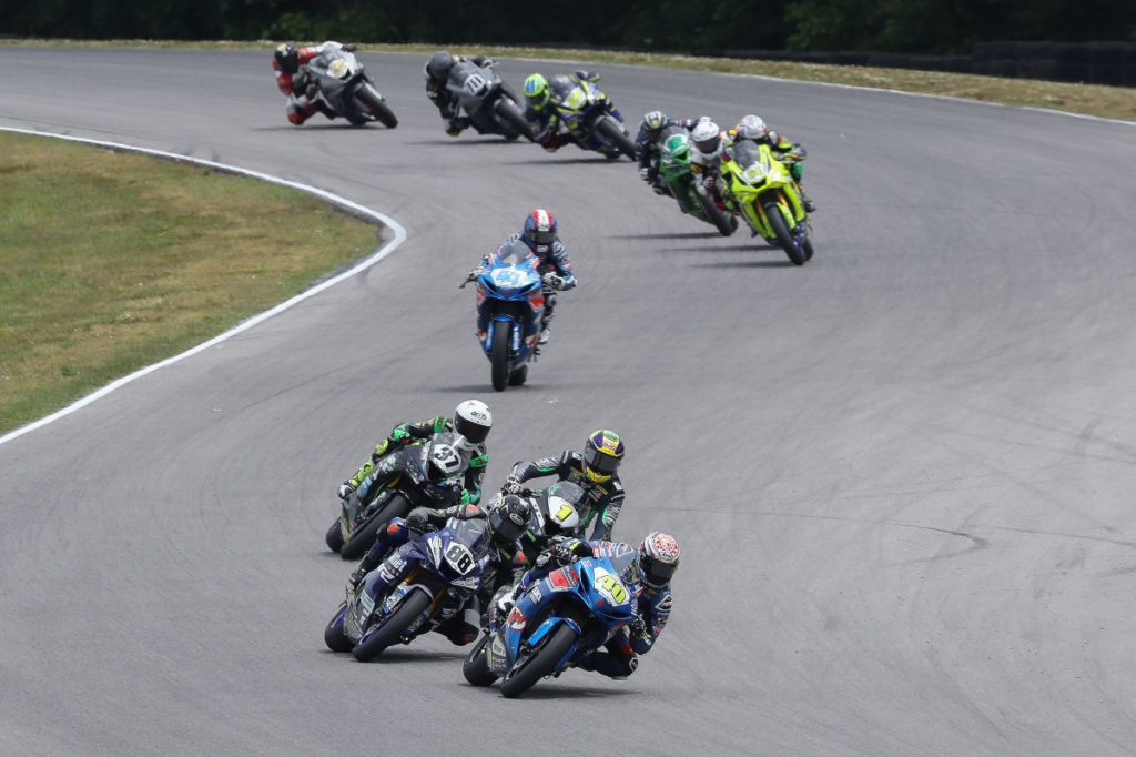 Sean Dylan Kelly (40) leads Benjamin Smith (88), Richie Escalante (1), Stefano Mesa (37), Sam Lochoff (44) and the rest of the MotoAmerica Supersport field early in Race One. Photo by Brian J. Nelson, courtesy MotoAmerica.