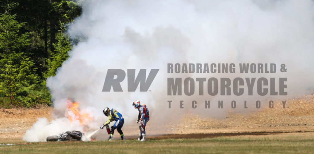 MotoAmerica Superbike racer Jeremy Coffey extinguishes a fire on Bobby Fong's crashed M4 ECSTAR Suzuki GSX-R1000. Photo by Brian J. Nelson.