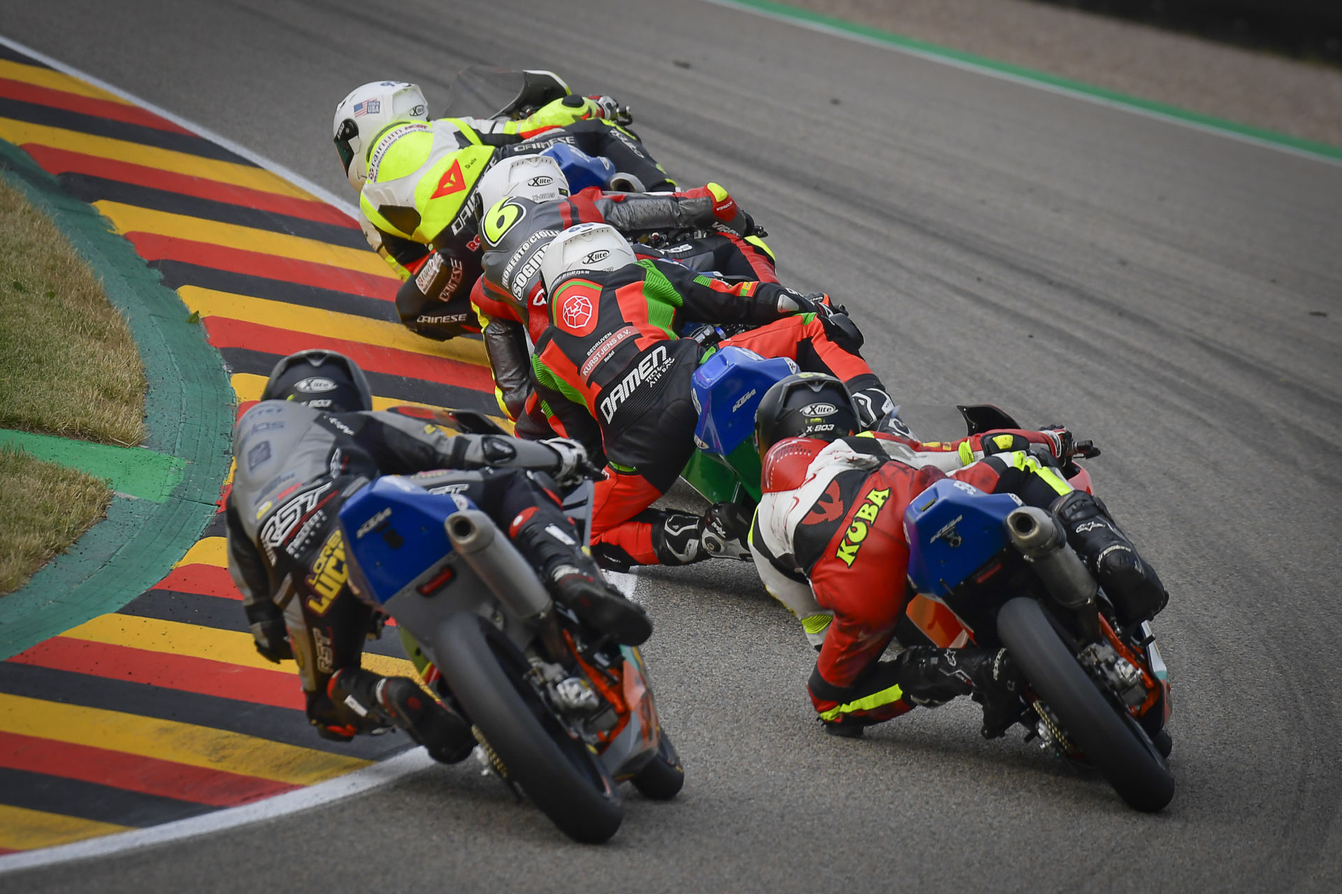 Action from Northern Talent Cup Race One at Sachsenring, with Hungarian American Rossi Moor leading. Photo courtesy Dorna.