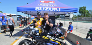 Ford President and CEO Jim Farley (right) with former Superbike racer Chris Ulrich (left) after they rode together on the Dunlop ECSTAR Suzuki GSX-R1000R two-seat Superbike June 13 during the MotoAmerica event at Road America. Photo by David Swarts.
