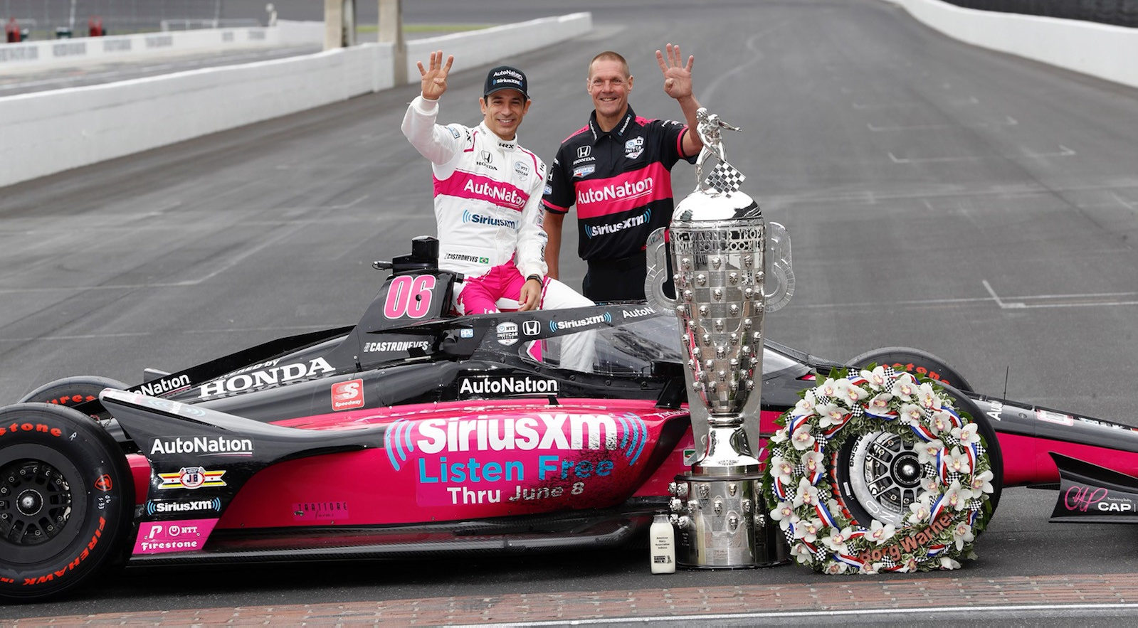 Former motorcycle road racer Perry Melneciuc (right) with 2021 Indy 500 race winner Helio Castroneves (left) and the Meyer Shank Racing #06 car at Indianapolis Motor Speedway the day after the race. Photo courtesy Meyer Shank Racing.