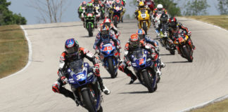 Jake Gagne (32) leads Josh Herrin (2), Cameron Petersen (45), and the rest of the field at the start of MotoAmerica Superbike Race One at Road America. Photo by Brian J. Nelson.