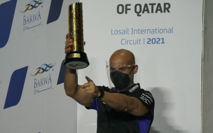 Esteban García Amoedo on the MotoGP podium, after Maverick Vinales won the opening race of the 2021 season in Qatar. Photo courtesy Monster Energy Yamaha. Esteban García Amoedo on the MotoGP podium, after Maverick Vinales won the opening race of the 2021 season in Qatar. Photo courtesy Monster Energy Yamaha.