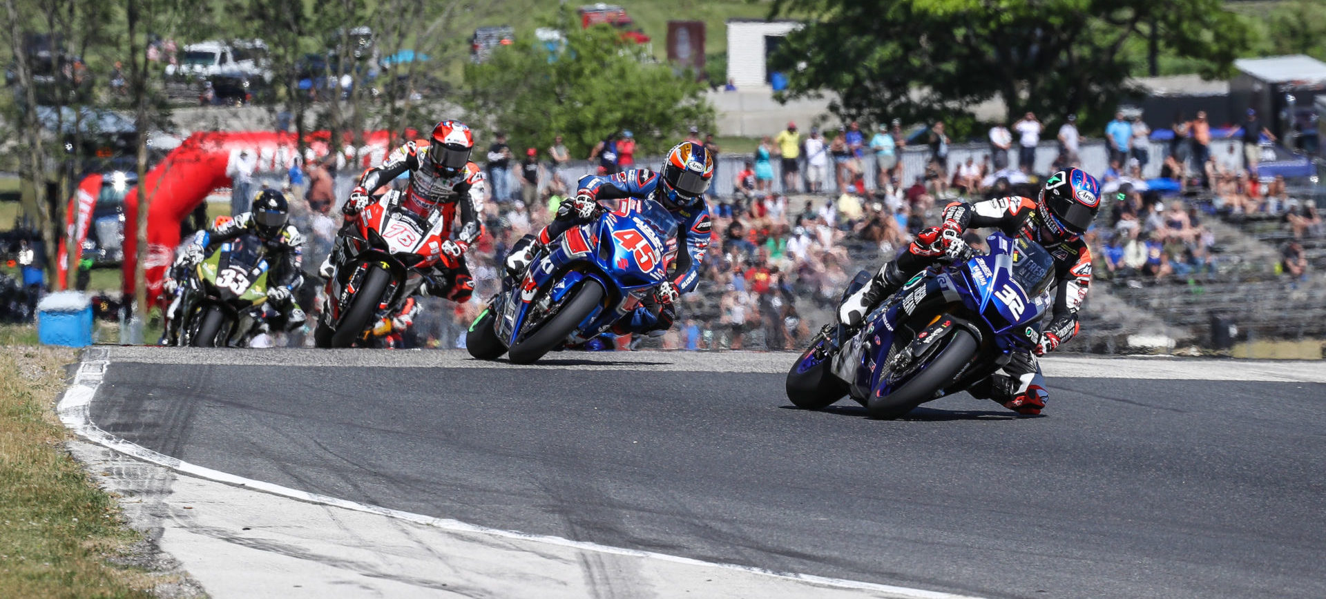 Jake Gagne (32) leads Cameron Petersen (45), Loris Baz (76) and Kyle Wyman (33) early in MotoAmerica Superbike Race Two. Photo by Brian J. Nelson.