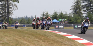 Jake Gagne (32) leads Josh Herrin (2), Cameron Petersen (32), Mathew Scholtz (11), Loris Baz (76), Bobby Fong (50), and the rest of the field early in Superbike Race Two at Ridge Motorsports Park. Photo by Brian J. Nelson, courtesy MotoAmerica.