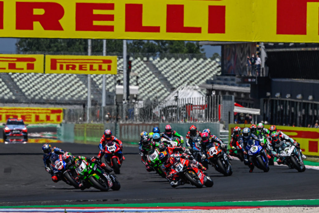 Jonathan Rea (1), Toprak Razgatlioglu (54), and Michael Ruben Rinaldi (21) fight for the lead at the start of World Superbike Race One at Misano. Photo courtesy Dorna.