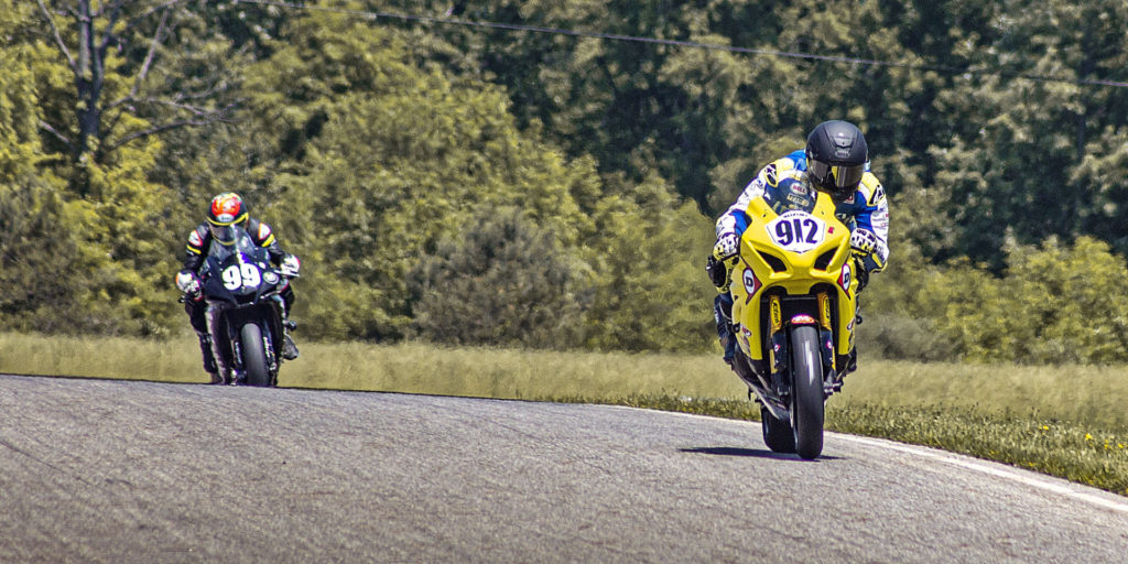 Twisted Speed Racing's Hayden Gillim (912) leads Army Of Darkness (99) en route to its second straight N2/WERA National Endurance Series By Dunlop Heavyweight victory. Photo by Justin Friedl, courtesy Twisted Speed Racing.