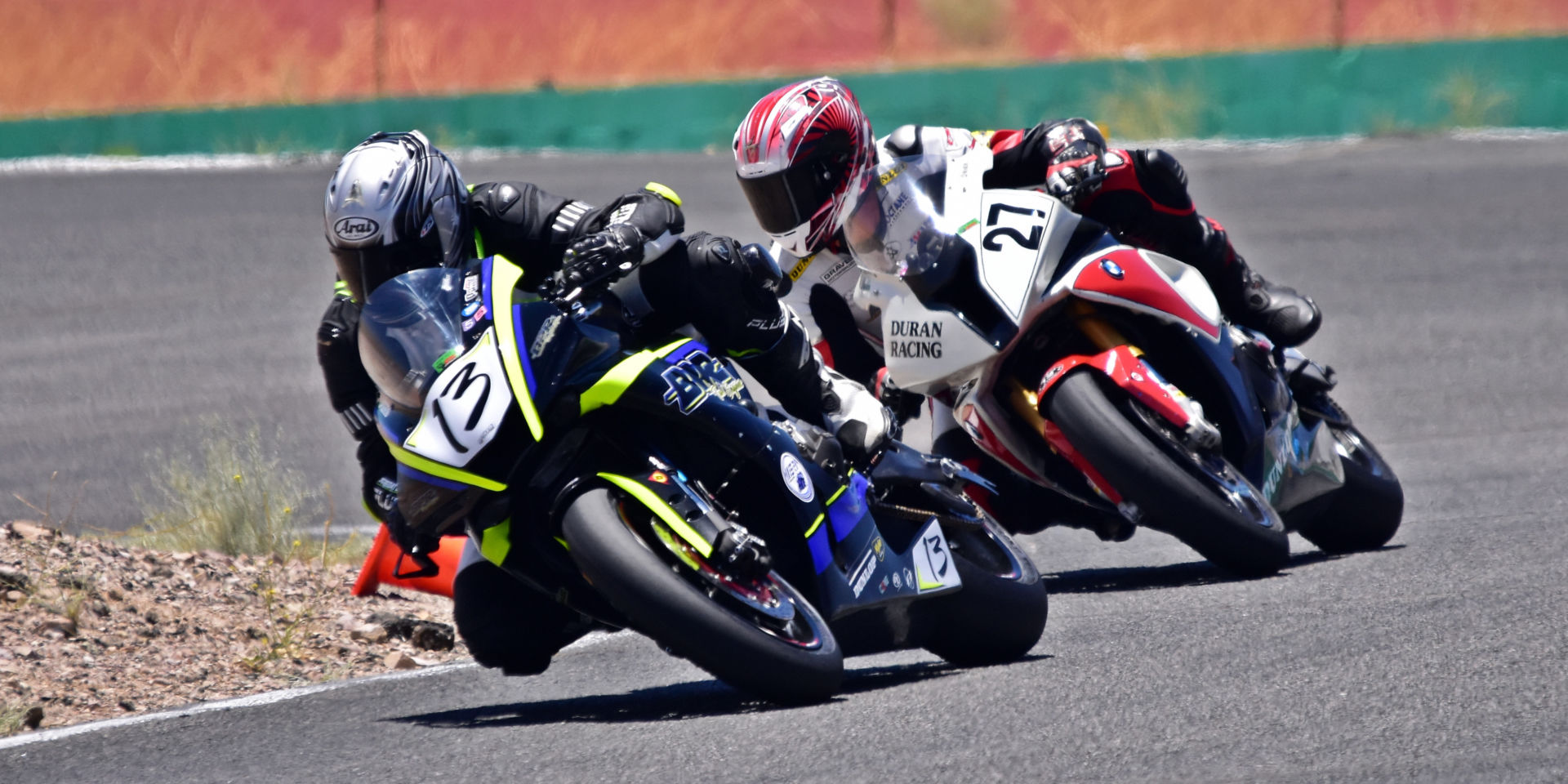 David Price (13) leads Chris Duran (27) through the Omega at Willow Springs International Raceway on Saturday in the Lucas Oil Products WERA West Formula One race. Duran won, with Price a close second. Photo by Michael Gougis.