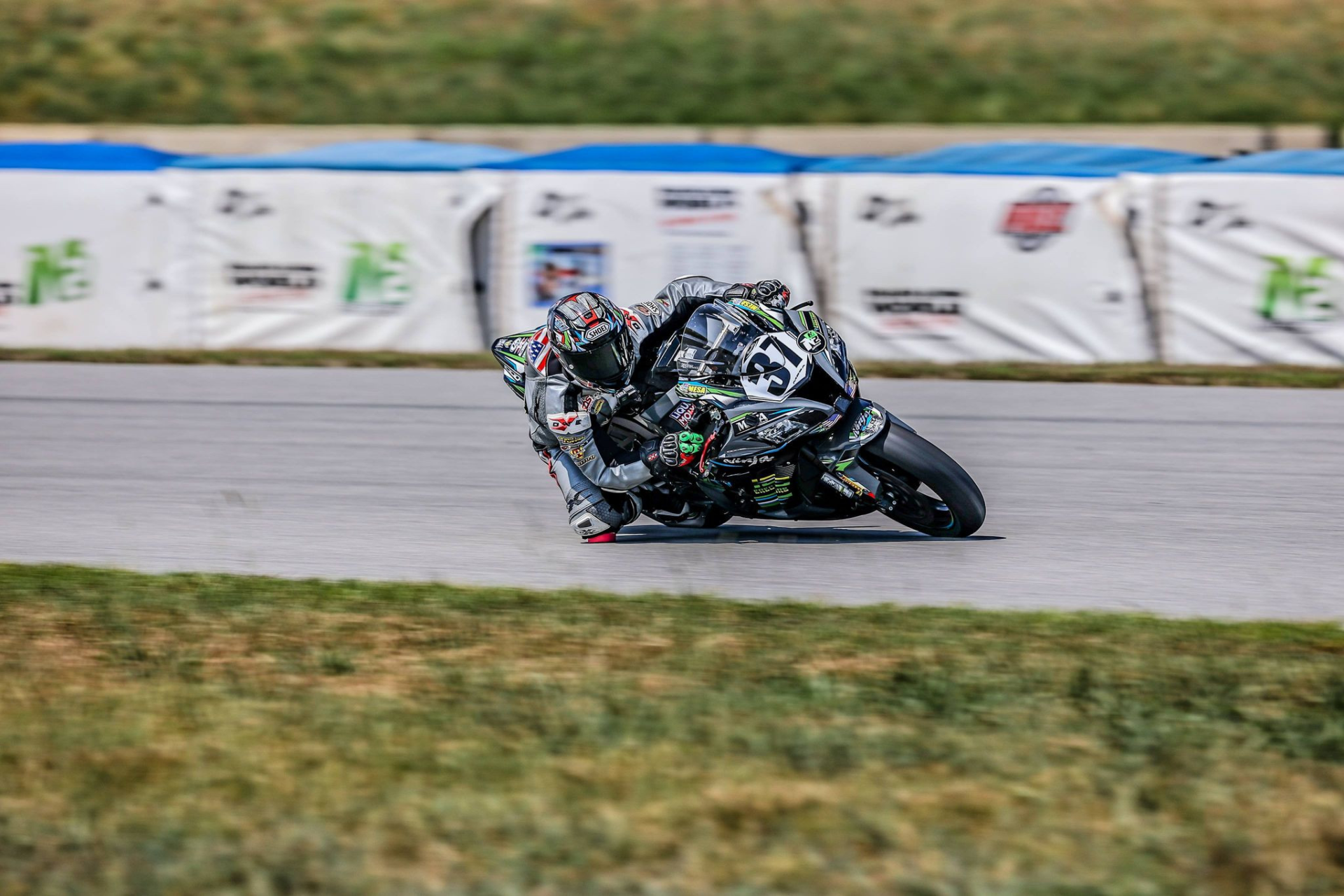 Stefano Mesa (37) passes sections of Airfence soft barriers deployed at NCBike thanks to the fund-raising efforts of N2 and the not-for-profit Roadracing World Action Fund (RWAF). Photo by Apex Pro Photography.