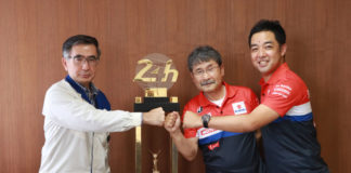 Toshihiro Suzuki, Representative Director and President of Suzuki Motor Corporation (left) accepts the 24 Hours of Le Mans first-place trophy from Yoshimura SERT Motul's Fujio Yoshimura (center) and Yohei Kato (right) and Suzuki Motor Corporation headquarters in Japan. Photo courtesy Team Suzuki Press Office.