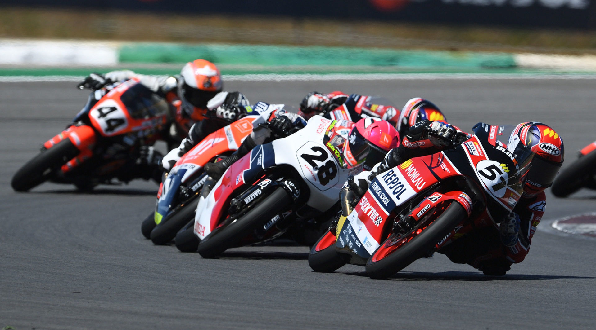 Brian Uriarte (51) leads Maximo Martinez (28) and a group of other riders during the Hawkers European Talent Cup race in Portugal. Photo courtesy FIM CEV Repsol Press Office.