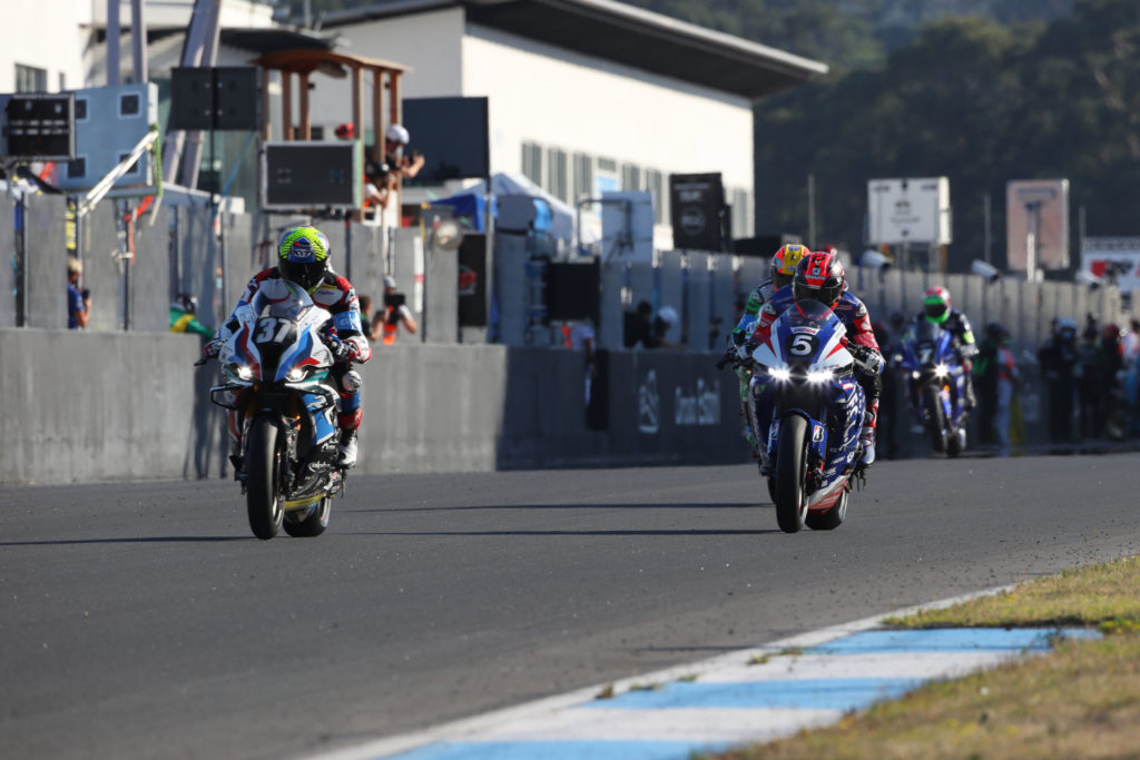 BMW Motorrad Motorsport's Xavi Fores leads F.C.C. TSR Honda France (5) early in the 12-Hours of Estoril. Photo courtesy BMW.