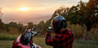 A rider enjoying a sunset from the seat of an Indian motorcycle. Photo courtesy Indian Motorcycle.