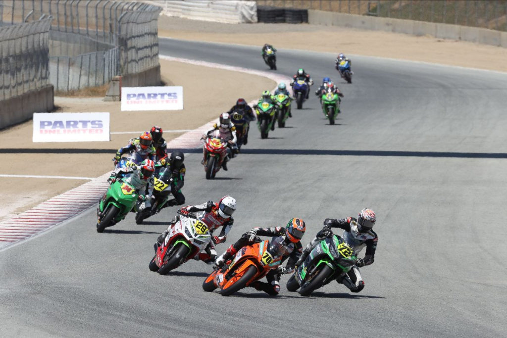 Tyler Scott (70) leads Ben Gloddy (72), David Kohlstaedt (29), and the rest of the field during the start of Junior Cup Race One. Photo by Brian J. Nelson, courtesy MotoAmerica.