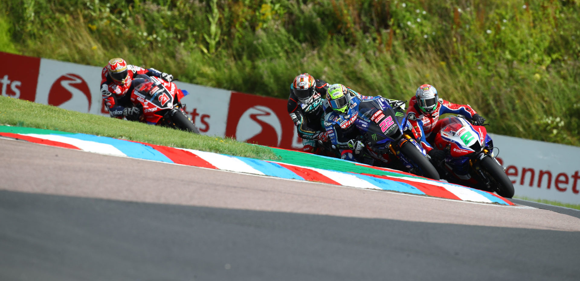 Jason O'Halloran (22), Glenn Irwin (2), Peter Hickman (behind O'Halloran), and Christian Iddon (21) in action during Race One at Thruxton. Photo courtesy MSVR.