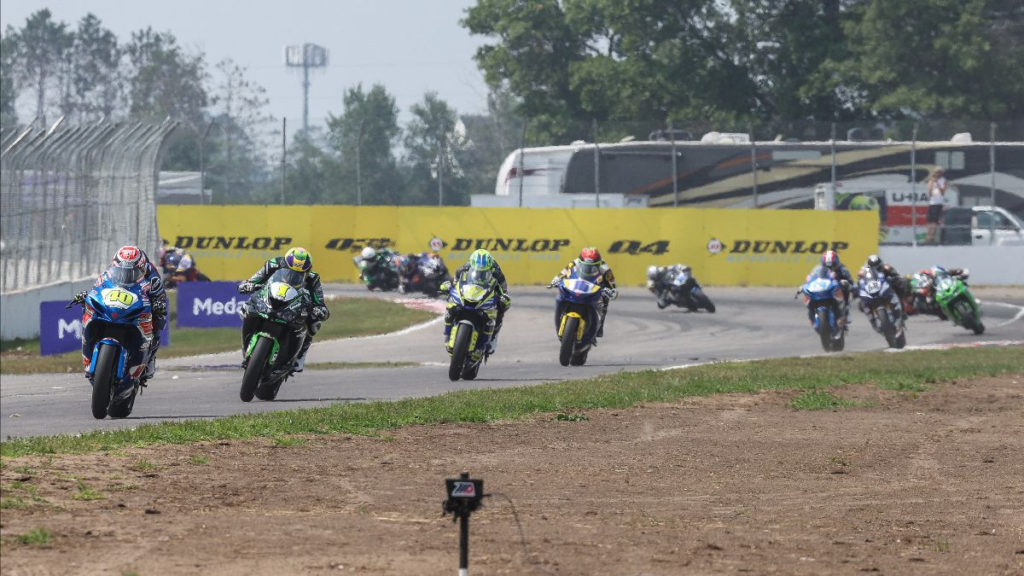 Sean Dylan Kelly (40) leads Richie Escalante (1), Rocco Landers (97), and the rest of the Supersport pack early in Saturday's Supersport final at Brainerd International Raceway. Photo by Brian J. Nelson.