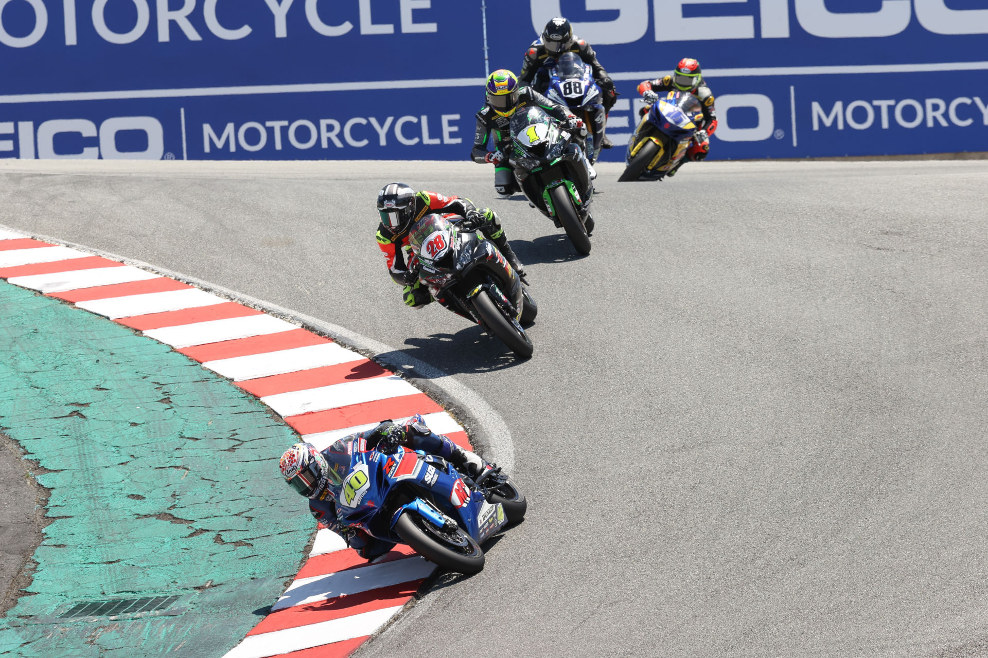 Sean Dylan Kelly (40) leads Cory Ventura (28), Richie Escalante (1), Benjamin Smith (88), and Kevin Olmedo (16) down the Corkscrew early in Supersport Race Two at Laguna Seca. Photo by Brian J. Nelson, courtesy MotoAmerica.